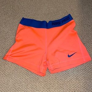 Neon coral and dark blue Nike spandex.
